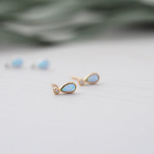 Boucles d'oreilles Paradise de couleur doré, pierre bleue opale